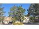 Las Colinas entrance sign with trees and beautiful homes in a well-manicured community at 2140 Desert Peak Rd, Las Vegas, NV 89134