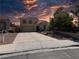 Charming two-story home with a well-manicured front yard and a spacious driveway at 2140 Desert Peak Rd, Las Vegas, NV 89134