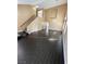 Spacious living room with high ceilings, a staircase, hardwood floors, and abundant natural light at 2140 Desert Peak Rd, Las Vegas, NV 89134