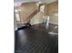 Open-concept living room featuring sleek tiled floors, a staircase, and recessed lighting at 2140 Desert Peak Rd, Las Vegas, NV 89134