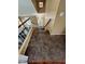 Welcoming staircase leading to the upper level, featuring neutral tones and plush carpeting at 2140 Desert Peak Rd, Las Vegas, NV 89134