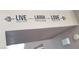 Motivational wall decor showcasing 'Live, Laugh, Love' with decorative elements on the walls at 2140 Desert Peak Rd, Las Vegas, NV 89134