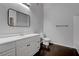 Modern bathroom featuring a sleek vanity, toilet, and tub with a glass shower at 2305 W Horizon Ridge Pkwy # 3921, Henderson, NV 89052