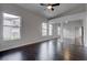 A bedroom featuring hardwood floors, ceiling fan, and mirrored closet doors at 2305 W Horizon Ridge Pkwy # 3921, Henderson, NV 89052