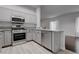 This contemporary kitchen features stainless steel appliances, granite counters, and bright white cabinets at 2305 W Horizon Ridge Pkwy # 3921, Henderson, NV 89052