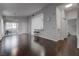 Open-concept living room with gleaming hardwood floors, access to balcony, and breakfast bar area at 2305 W Horizon Ridge Pkwy # 3921, Henderson, NV 89052