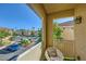 Cozy balcony with a view of the parking area and the surrounding residential area featuring green vegetation at 251 S Green Valley Pkwy # 3222, Henderson, NV 89012