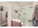 Bathroom featuring walk-in shower with glass door and tiled accent wall at 251 S Green Valley Pkwy # 3222, Henderson, NV 89012