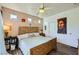 Bedroom with wood-look floors, ceiling fan, accent wall and natural light at 251 S Green Valley Pkwy # 3222, Henderson, NV 89012