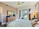 Bedroom showcasing wood-look floors, ceiling fan, and glass patio doors at 251 S Green Valley Pkwy # 3222, Henderson, NV 89012