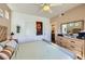 Bright bedroom with wood-look floors, ceiling fan, and ensuite bath at 251 S Green Valley Pkwy # 3222, Henderson, NV 89012