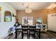 Inviting dining room features a modern chandelier, ample natural light, and stylish furnishings for comfortable meals at 251 S Green Valley Pkwy # 3222, Henderson, NV 89012