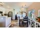 Bright and airy dining area next to a modern kitchen with stainless steel appliances and beautiful lighting at 251 S Green Valley Pkwy # 3222, Henderson, NV 89012