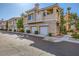 Beautifully landscaped condo building with attached garages and lush foliage at 251 S Green Valley Pkwy # 3222, Henderson, NV 89012