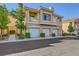 Attractive condo building featuring garages and well-maintained landscaping at 251 S Green Valley Pkwy # 3222, Henderson, NV 89012
