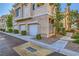 Multi-level condo with attached garages, trees, and manicured greenery at 251 S Green Valley Pkwy # 3222, Henderson, NV 89012