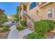 Condo building access with stairs, well-maintained landscaping and walkways at 251 S Green Valley Pkwy # 3222, Henderson, NV 89012