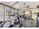 Well-equipped gym with modern fitness equipment, natural light, and pool views at 251 S Green Valley Pkwy # 3222, Henderson, NV 89012