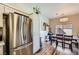 Well-equipped kitchen with stainless steel appliances, white cabinets, and an open dining area at 251 S Green Valley Pkwy # 3222, Henderson, NV 89012