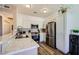 Well-lit kitchen featuring stainless steel appliances, light countertops, and wood-style flooring at 251 S Green Valley Pkwy # 3222, Henderson, NV 89012