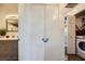 Hallway featuring a full bathroom, laundry closet, and additional storage at 251 S Green Valley Pkwy # 3222, Henderson, NV 89012