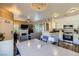 Open-concept home with views of the kitchen, living area, and dining table with a chandelier at 251 S Green Valley Pkwy # 3222, Henderson, NV 89012