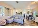 Bright, open living space showcases an L-shaped sofa and seamless transition to the kitchen and dining area at 251 S Green Valley Pkwy # 3222, Henderson, NV 89012