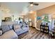 Open-concept living area with wood-look floors and a comfortable sofa, perfect for entertaining guests and relaxing at 251 S Green Valley Pkwy # 3222, Henderson, NV 89012
