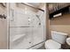 Modern bathroom with a glass-enclosed shower featuring a built-in seat and sleek fixtures at 2616 Faiss Dr, Las Vegas, NV 89134