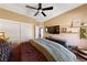 Comfortable bedroom offering a ceiling fan, TV, dresser and natural light at 2616 Faiss Dr, Las Vegas, NV 89134