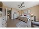 Well-lit bedroom with a neutral color scheme, tile flooring, and modern decor at 2616 Faiss Dr, Las Vegas, NV 89134