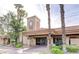 Exterior view of fitness center with clock tower, highlighting the community's recreational amenities in a tropical landscape at 2616 Faiss Dr, Las Vegas, NV 89134