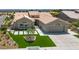 Beautiful single-story home with a well-manicured lawn, elegant landscaping, and a spacious two-car garage at 2616 Faiss Dr, Las Vegas, NV 89134