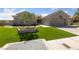 A single-story home featuring a well-manicured lawn, elegant landscaping, and an attached two-car garage at 2616 Faiss Dr, Las Vegas, NV 89134