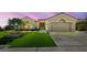 Lovely single-story home featuring an attached two-car garage, desert landscaping, and a pristine front lawn at 2616 Faiss Dr, Las Vegas, NV 89134