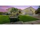 Beautiful single-story home with a manicured lawn and desert landscaping featuring an attached two-car garage at 2616 Faiss Dr, Las Vegas, NV 89134
