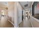 Spacious hallway featuring neutral tones, tile flooring, and recessed lighting at 2616 Faiss Dr, Las Vegas, NV 89134