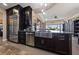 Kitchen island with a stainless steel sink and dishwasher, ample counter space, and view of the neighborhood at 2616 Faiss Dr, Las Vegas, NV 89134