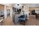 Kitchen island with bar seating, stylish tile accents, and a view into the main living areas at 2616 Faiss Dr, Las Vegas, NV 89134