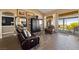 Cozy living room with leather furniture, stylish flooring, and sliding glass doors leading to outdoor space at 2616 Faiss Dr, Las Vegas, NV 89134