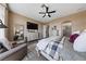 Spacious main bedroom features a sitting area, large dresser with TV, and ensuite bathroom access at 2616 Faiss Dr, Las Vegas, NV 89134