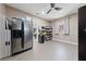 Large storage room with a stainless steel refrigerator, shelving units, and plenty of space for storage at 2616 Faiss Dr, Las Vegas, NV 89134