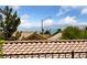 Excellent mountain view through the trees, from this lovely homes exterior at 2616 Faiss Dr, Las Vegas, NV 89134