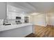 Well-lit kitchen featuring stainless steel appliances and a breakfast bar, seamlessly connected to the dining area at 2725 S Nellis Blvd # 2036, Las Vegas, NV 89121