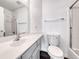 Bathroom featuring vanity, mirror, toilet and shower-tub with glass sliding doors at 2766 Red Vista Ct, Henderson, NV 89074
