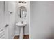 Small bathroom featuring a pedestal sink, modern lighting, and updated fixtures at 2766 Red Vista Ct, Henderson, NV 89074