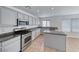 Bright kitchen featuring granite countertops, stainless steel appliances, and a central island at 2766 Red Vista Ct, Henderson, NV 89074