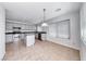Well-lit kitchen features stainless steel appliances, center island, tile flooring and granite countertops at 2766 Red Vista Ct, Henderson, NV 89074