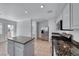Open kitchen with granite countertops, stainless steel appliances, and tile floors at 2766 Red Vista Ct, Henderson, NV 89074