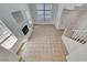 Open-concept living area featuring tile floors, a fireplace, and abundant natural light at 2766 Red Vista Ct, Henderson, NV 89074
